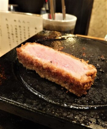 piece of beef cutlet on the hot stone